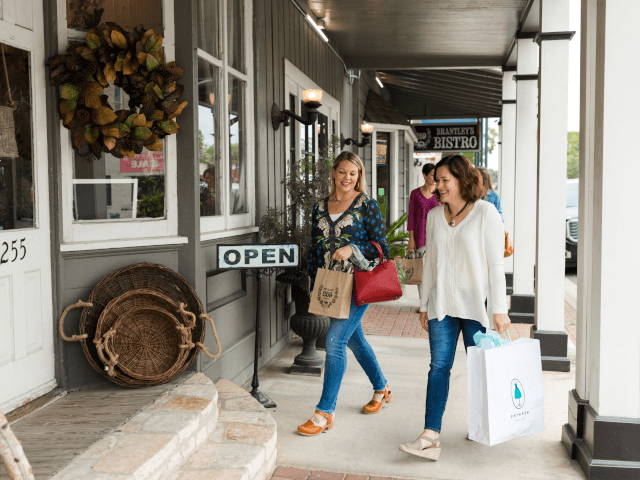 Two women shopping together downtown